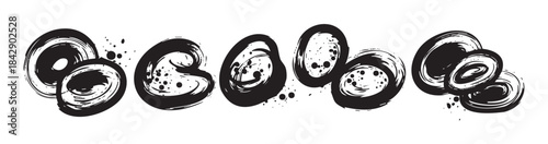 Abstract black ink brushstrokes arranged in a creative and textured artistic composition, featuring various circular and oval shapes with scattered splatters.