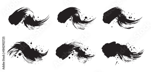 Dynamic black ink brush strokes with expressive textures and artistic splatters, creating a versatile graphic element for modern designs.