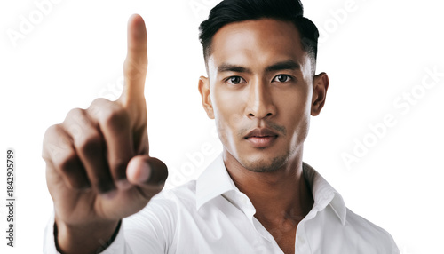 Professional man pointing finger to interact with virtual screen in studio