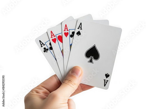 Close up of hand holding four aces playing cards ready for poker game winning hand