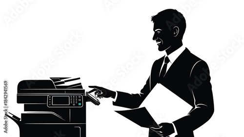 A silhouette of a businessman using a photocopier handling documents in a modern office setting
