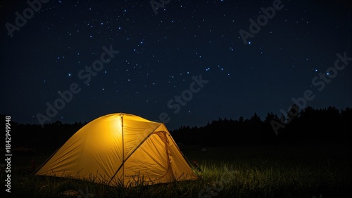 Camping tent under a starry night sky. Nature and outdoor adventure, camping, stars, night scenery. The scene of wilderness and stargazing.