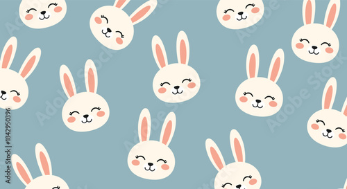 Playful pattern of white bunny faces with pink cheeks on a soft blue background evokes cheerful spring vibes ideal for fabric prints and kid friendly decor.
