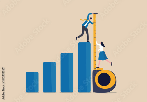 Business benchmark measurement, KPI, key performance indicator to evaluate success, improvement or business growth concept, businessman and woman help using measuring tape to measure bar graph.