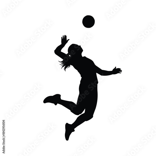 Female volleyball player in mid air spike