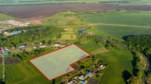 A piece of land, encompassing a view from above, a specific point on the ground, and a line that marks its boundaries. This land can be purchased, sold, developed, rented, or invested in. High quality