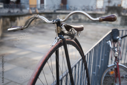 a close-up of a vintage penny-farthing bicycle, also known as a high wheel or ordinary bicycle. 
