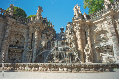 A long-exposure wide-angle photograph of the fountains within Dresden's Royal Palace on a clear summer day
