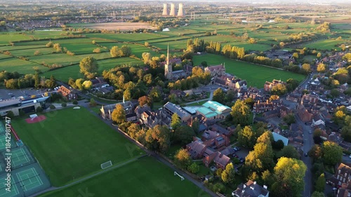 aerial view of Repton in Derbyshire, revealing the historic village layout, surrounding countryside, rooftops, roads, and green spaces within the rural English landscape