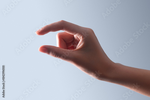 Hand Making Small Size Gesture Close-Up