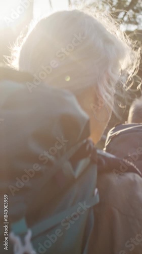 Wallpaper Mural Grey haired couple hikes carrying rucksacks across rural site Torontodigital.ca