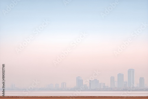 Urban Skyline of Luanda at Dawn Showcasing Modern Buildings and Soft Colors Over the Horizon