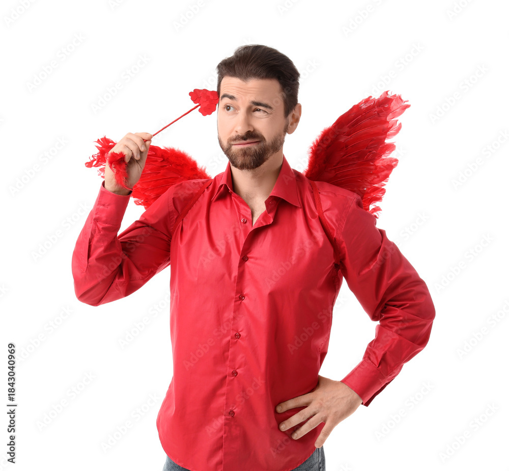 Obraz premium Thoughtful man dressed as Cupid with arrow on white background. Valentine's Day celebration