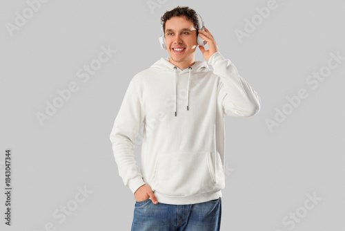 Young man in white hoodie w...