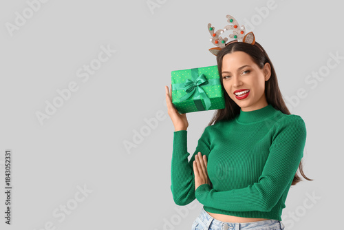 Happy young woman in reinde...
