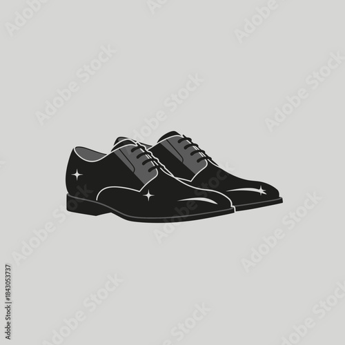 Two shiny dress shoes with laces are displayed in a pair.