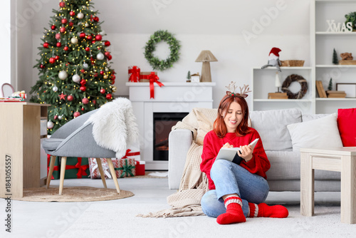 Young woman in reindeer hor...