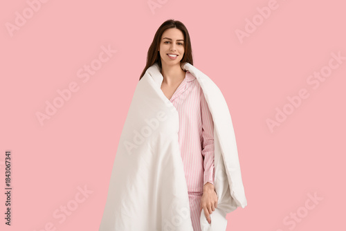 Young woman in pajamas with...