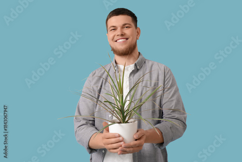 Young handsome man with pla...