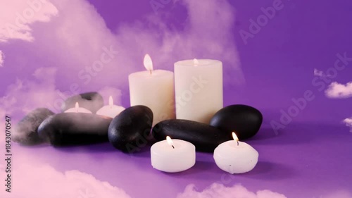 Decorative spa candles and stones flickering causing mist drifting in to veil front and evoke calm