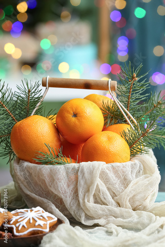 Basket with tasty oranges a...