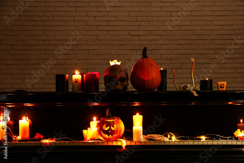 Grand piano with burning ca...