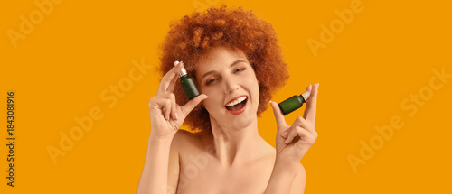 Happy young redhead woman w...
