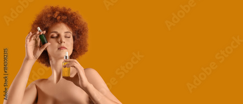 Young redhead woman with na...