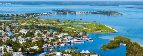 Photography Rich neighborhood with expensive vacation homes in Boca Grande, small town on Gasparilla Island in southwest Florida