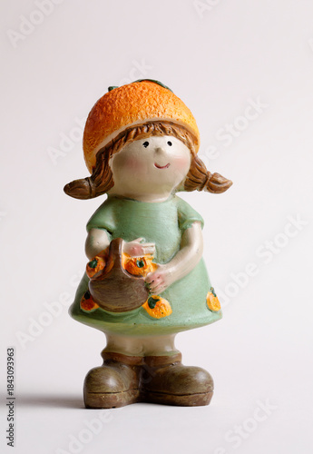 Cute little girl figurine with basket