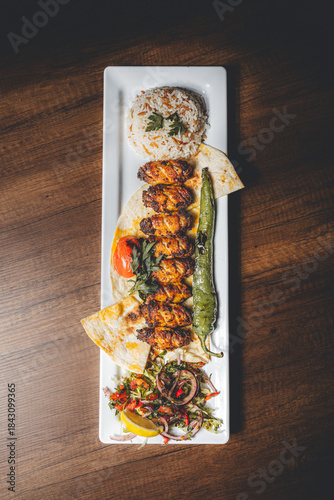 grilled chicken wings from charcoal fire with vegetables