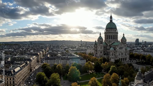 Epic aerial timelapse over Brussels showcasing the historic Royal Church of Saint Mary against a dramatic cloudy sky