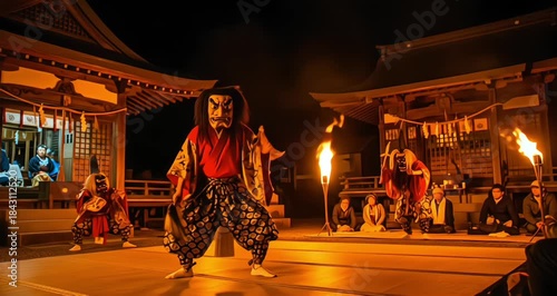 Traditional Japanese Kagura dance performance featuring a masked demon figure on a wooden shrine stage at night illuminated by fire torches