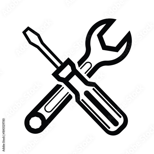Crossed screwdriver and wrench isolated on