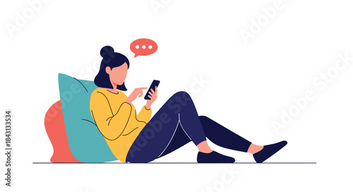 Young woman relaxing and leaning against a pillow while happily texting or browsing social media on her smartphone at home.