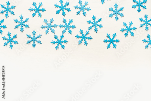 snowflakes on blue background. Blue snowflake background. Snowflake texture.