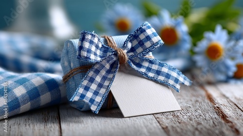 Blank square favor tag mockup with preppy blue and white gingham bow, designed for a child's birthday party, featuring soft lighting, gentle shadows, and pastel airy aesthetic for festive celebrations