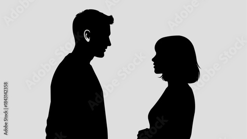 Silhouette of a man and woman facing each other in profile.