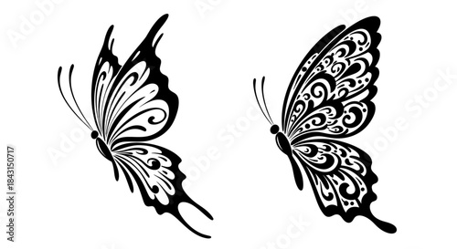 Two elegant black and white butterfly designs with intricate ornamental patterns on their wings, isolated on a white background.