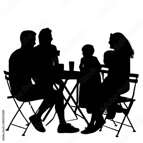 Silhouette of a family of four sitting around a table outdoors
