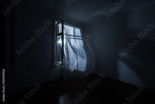 The wind from the window flutters the curtains in the old house in the moonlight.