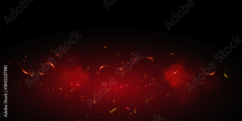 Flame of fire with sparks on a black background. The texture of the fiery storm. The fiery sparks of lights flash, a shot of a flying spark in the air. a dark night.