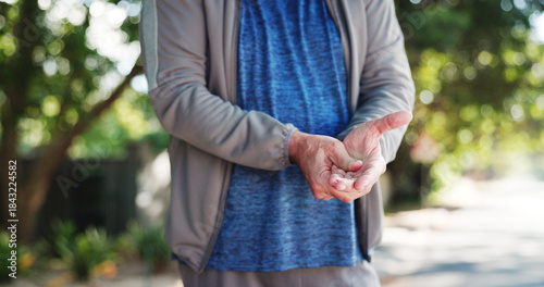Senior man, hands and wrist pain with injury in nature for carpal tunnel syndrome in road. Closeup, elderly or male person with sore arm or fibromyalgia for joint inflammation or muscle tension
