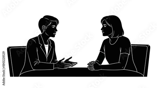 Two people engaged in a conversation while seated on a couch