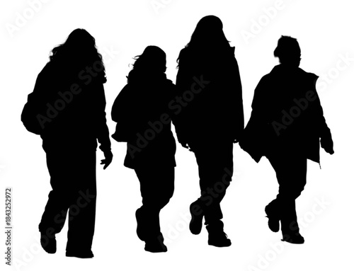 Four young women walking outdoors on a city street.