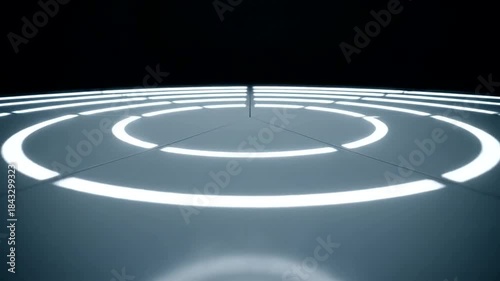 Abstract view of illuminated circular patterns on a dark surface creating depth