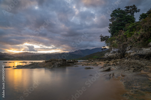 Long Exposure Sunset Landscape of Tinline Bay in Abel Tasman National Park New Zealand