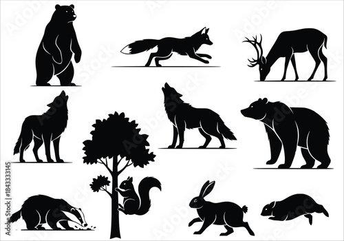  silhouettes of forest animals and a tree isolated on white 