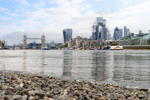 Tower Bridge and London skyline viewed from the River Thames foreshore