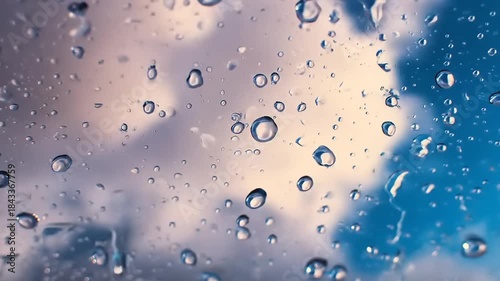 Abstract macro shot of water droplets against a blue and white background
